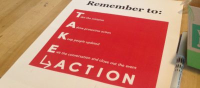 A flyer with take action on the table